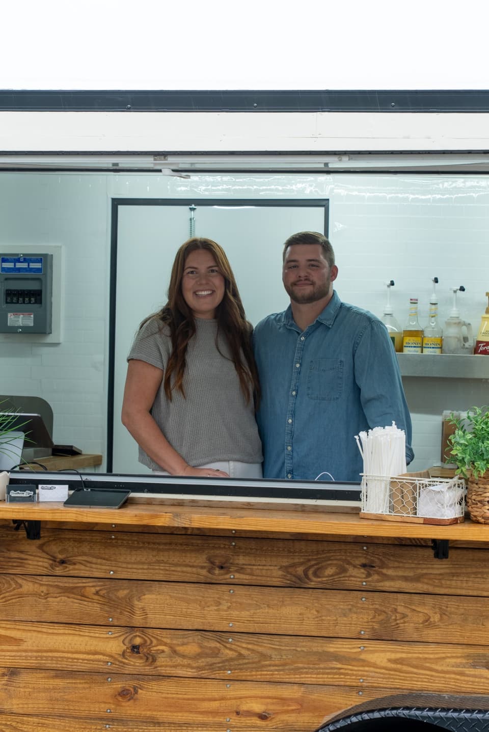 The founders of Southern Sips smiling at the trailer service window